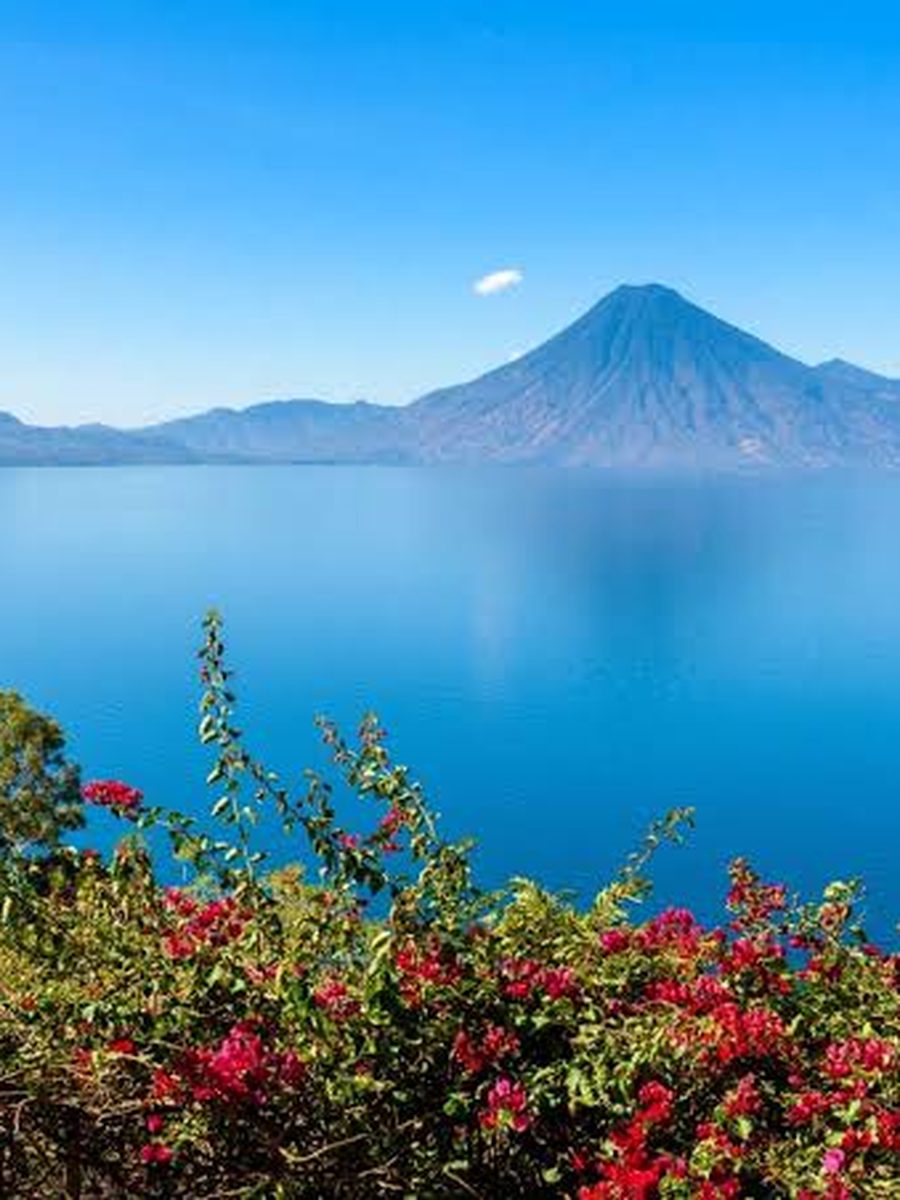 Lake Atitlan in Guatemala, volcanoes rising beyond the water