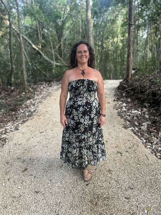Jessica standing radiant on the white jungle path