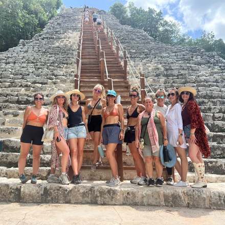 Sisters gathered at the base of the great Coba pyramid
