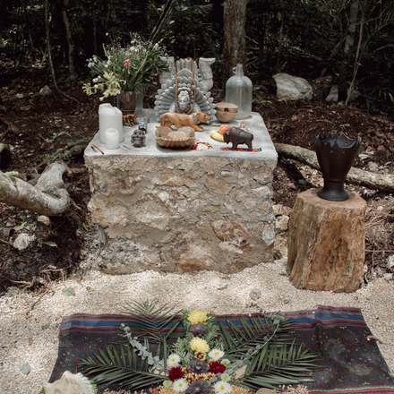 The Mayan altar dressed with flowers, seeds, and offerings